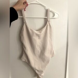 Zulu and Zephyr cream towelette ribbed one piece.